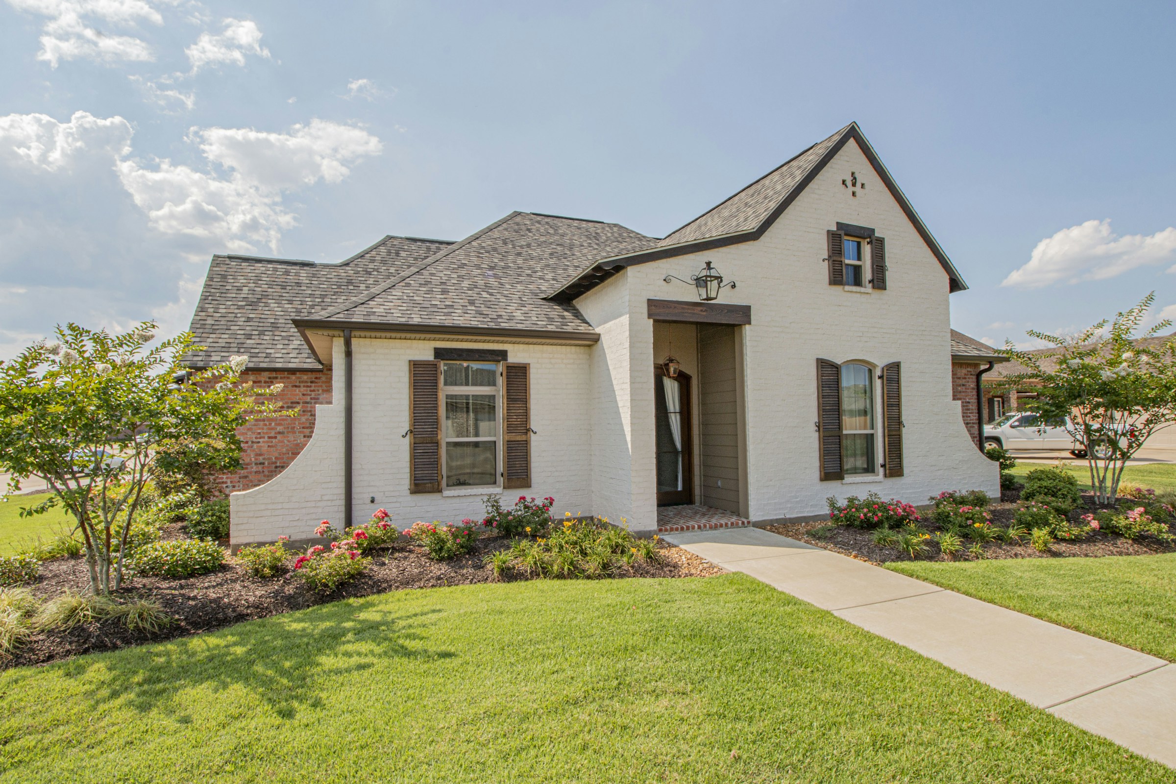 A single-family home with a well-kept front yard